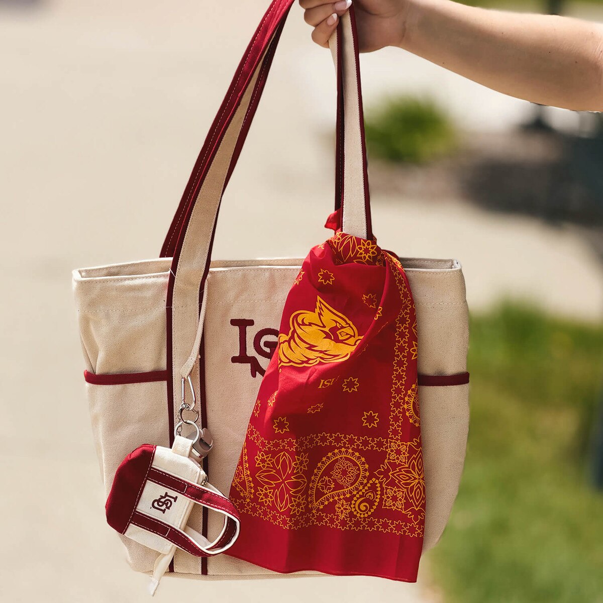Iowa State Punching Cy Cardinal Bandana 22-inch x 22-inch tied on a boat tote with matching keychain